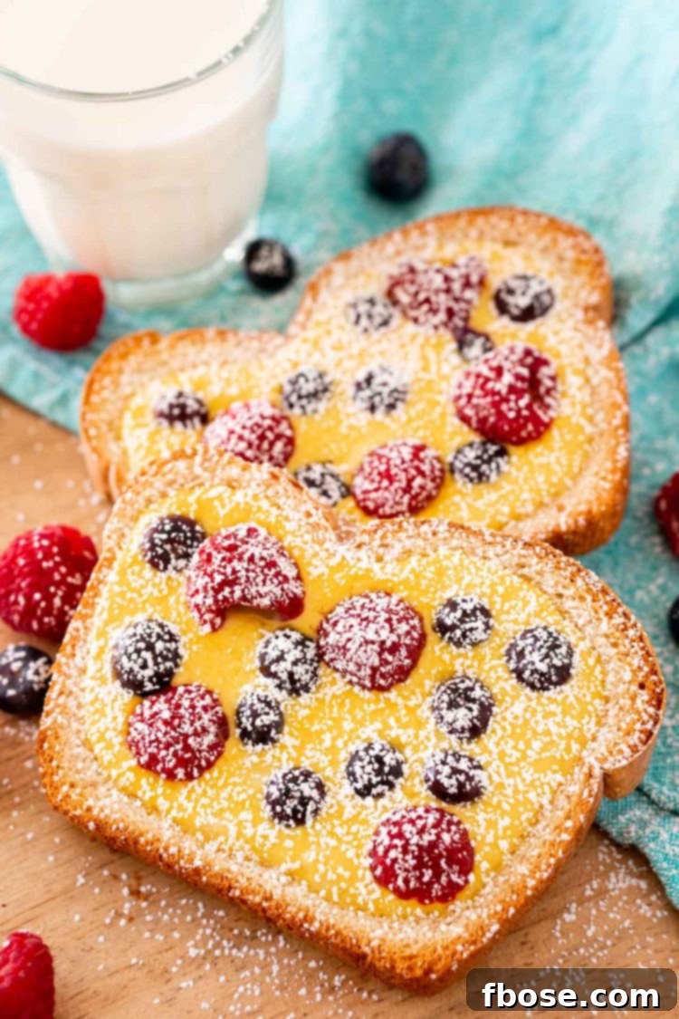 Yogurt Custard Toast 3 Custard toast on a wooden cutting board dusted with powdered sugar.