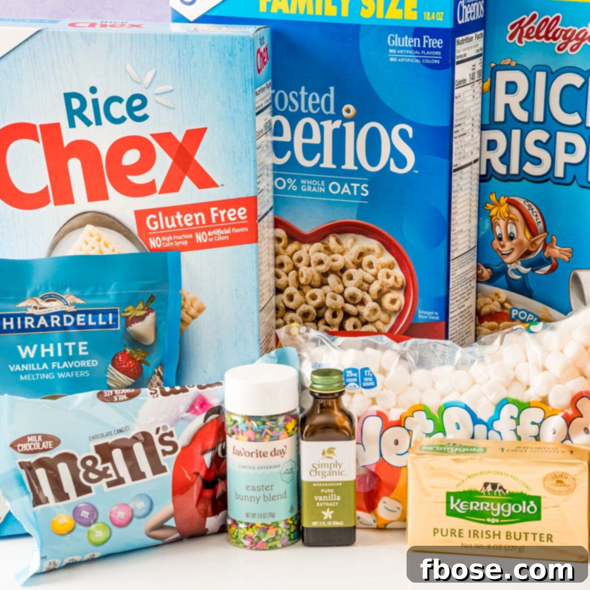 Ingredients to make easter rice krispie treats on a white table.