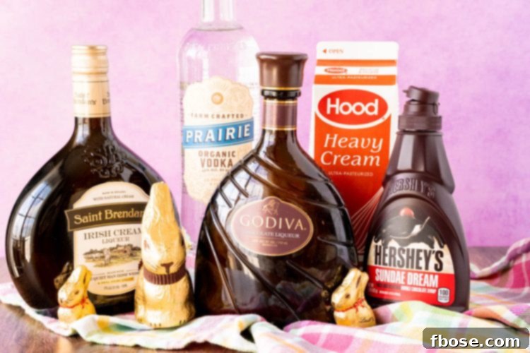 Ingredients to make a festive chocolate Easter cocktail, including vodka, Irish cream, chocolate liqueur, heavy cream, and chocolate bunnies.