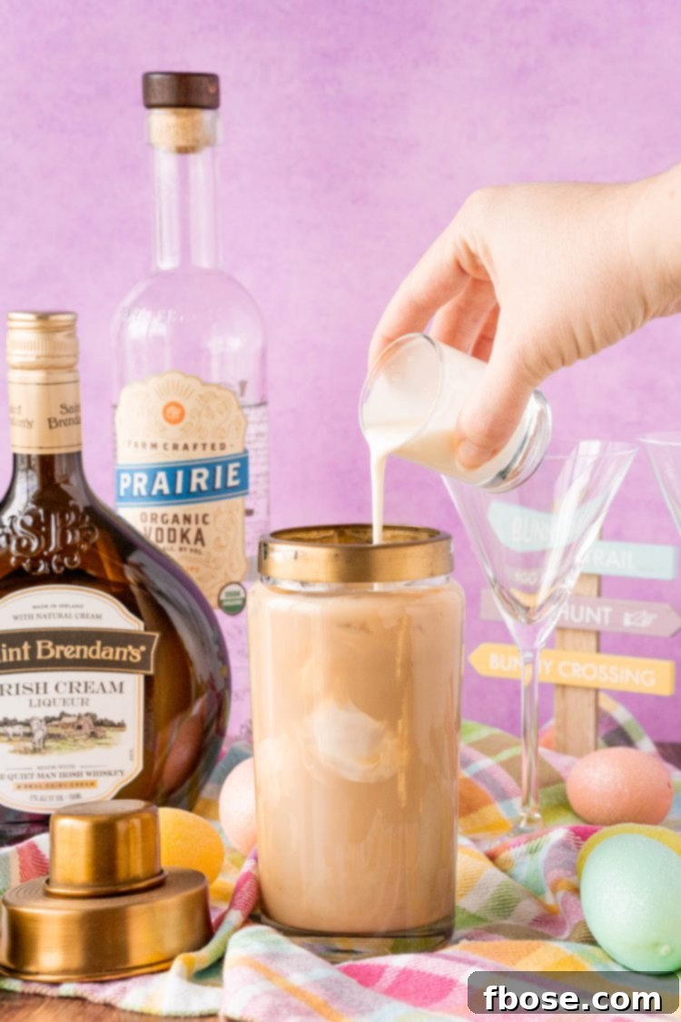 Chocolate cocktail being prepared in a cocktail shaker, illustrating the mixing process.