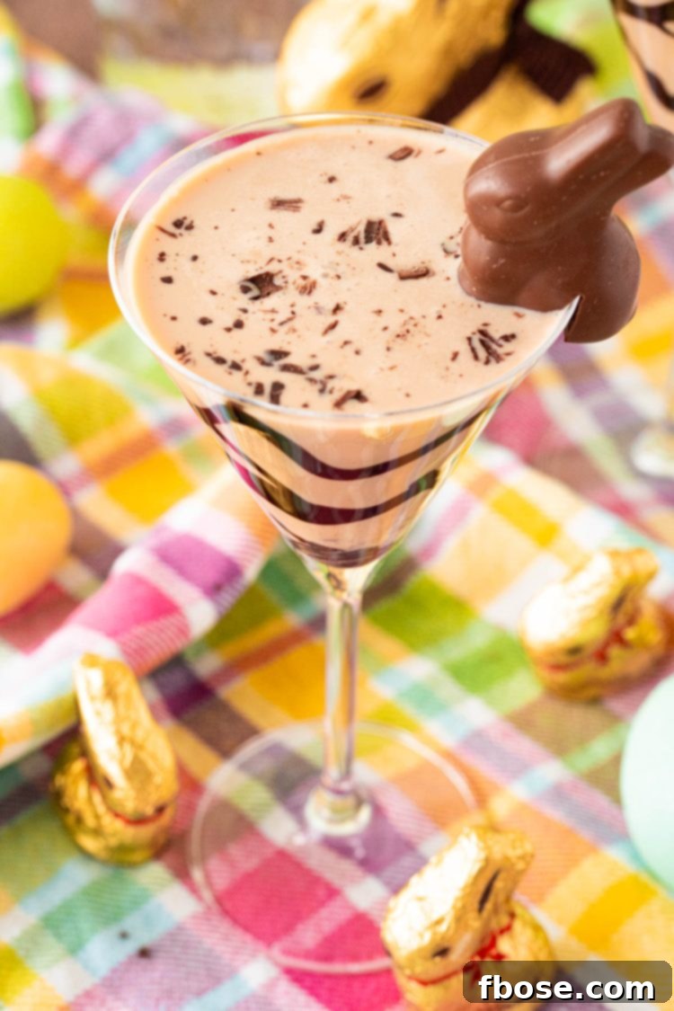 Close up photo of a chocolate easter bunny martini on a colorful napkin, showcasing its festive appeal.