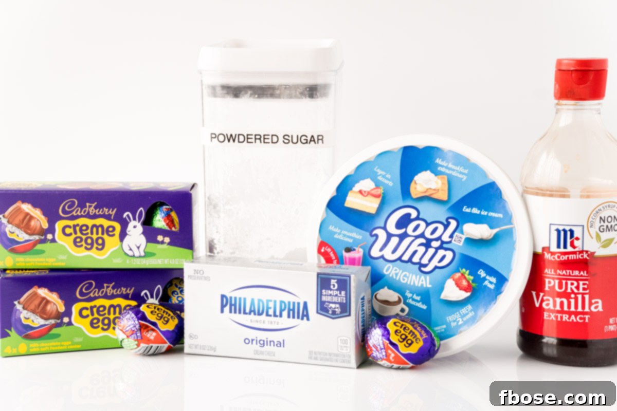 Ingredients to make cadbury creme egg dip laid out on a white table.