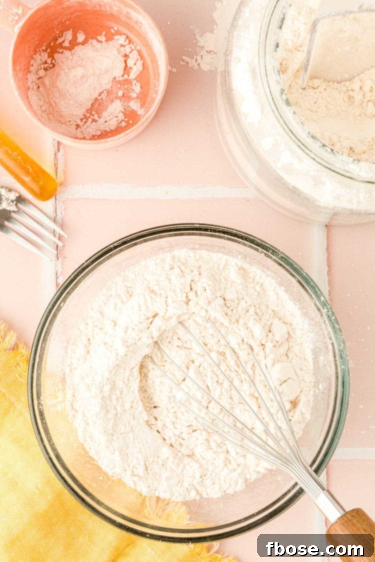 Flour in a bowl being whisked.