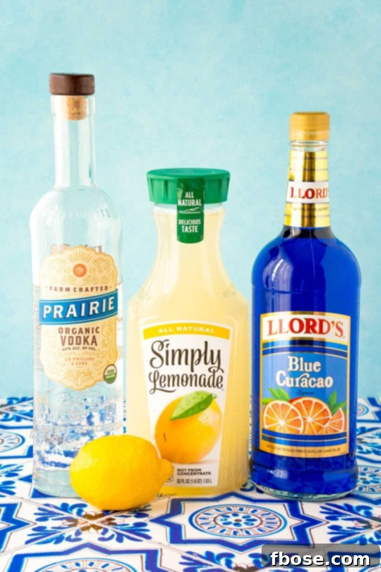 Azure Escape 4 A selection of fresh lemons, vibrant blue curacao, clear vodka, and sweet maraschino cherries – all the essential ingredients poised to create a dazzling Blue Lagoon cocktail.