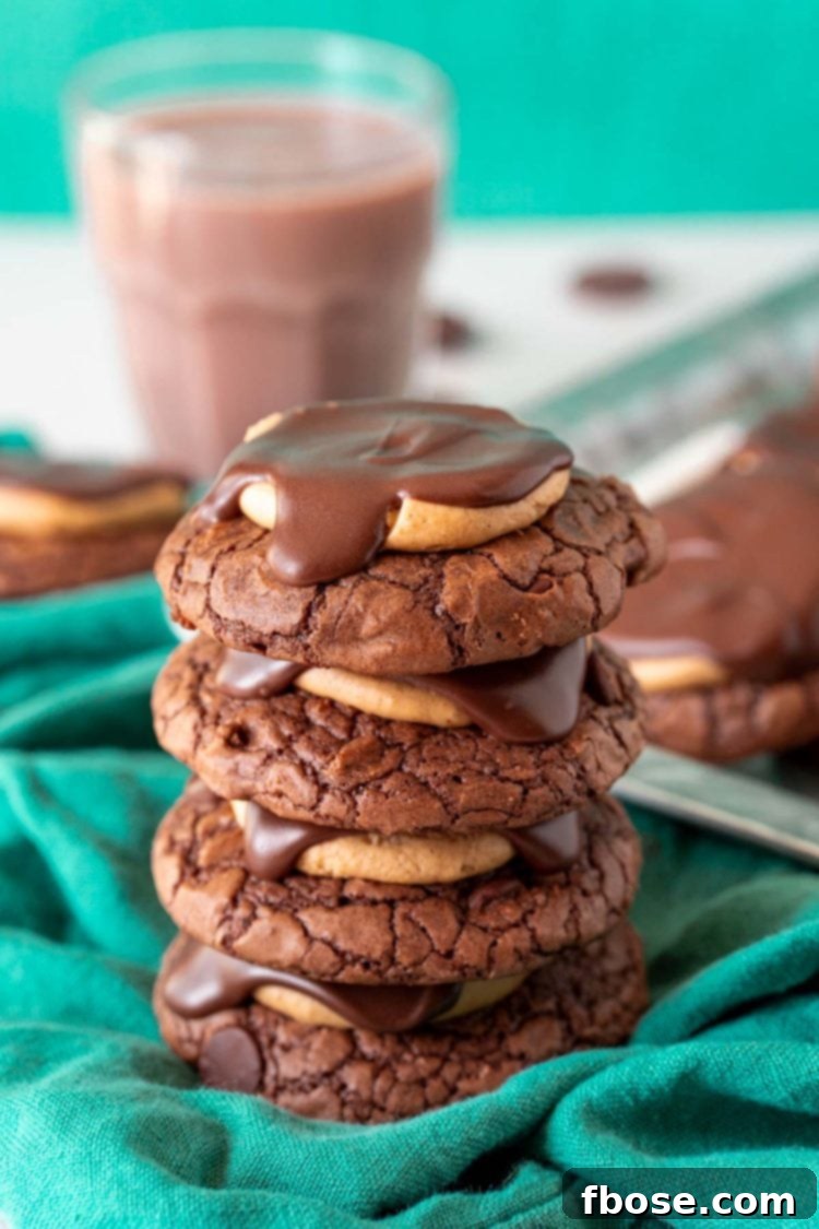A perfectly stacked set of four Buckeye Cookies, showcasing their appealing layers and rich color contrast between the chocolate and peanut butter.