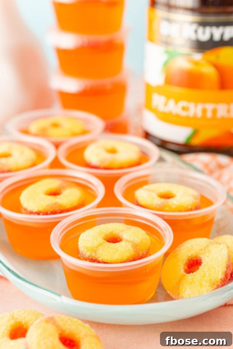Peachy Keen Jell-O Shots 2 Fuzzy navel jello shots on a blue plate.