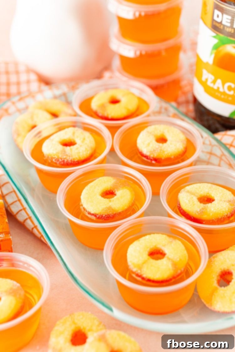 Peachy Keen Jell-O Shots 5 Fuzzy Navel Jello Shots on a blue plate.