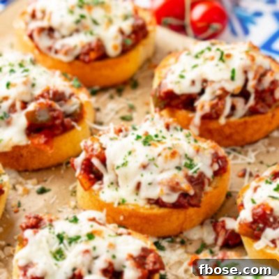 Texas Toast Sloppy Joes on a piece of parchment paper on a baking sheet, ready for serving.