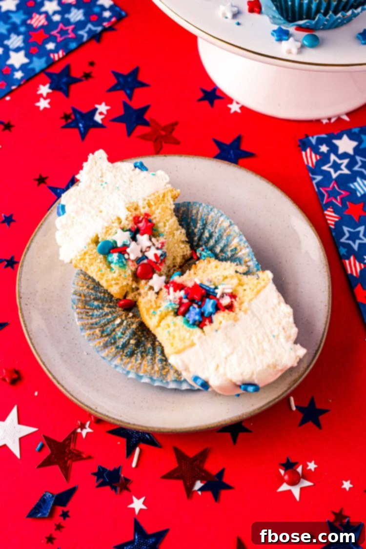 4th of July cupcake cut in half to reveal sprinkles inside.