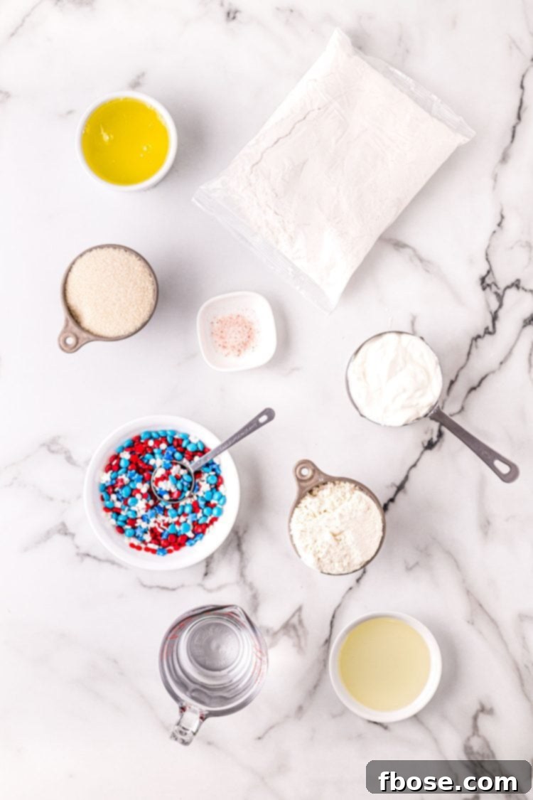 Ingredients to make 4th of July cupcakes on a marble surface.
