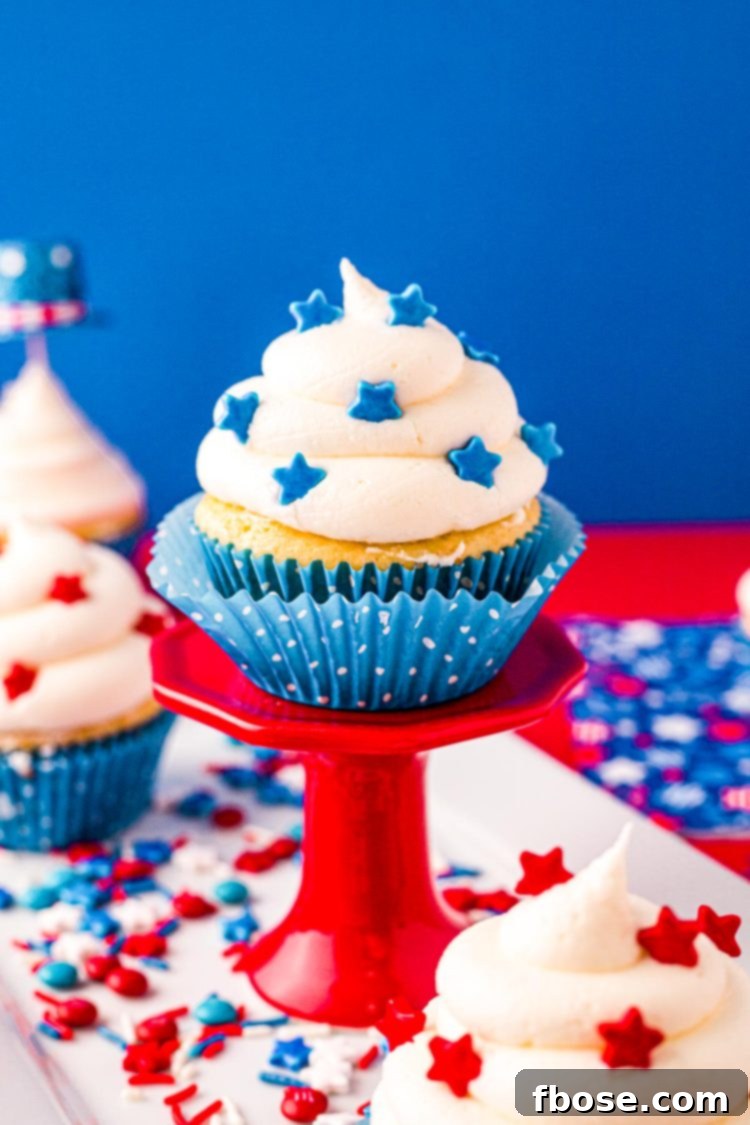 4th of July cupcake on a red cupcake stand.