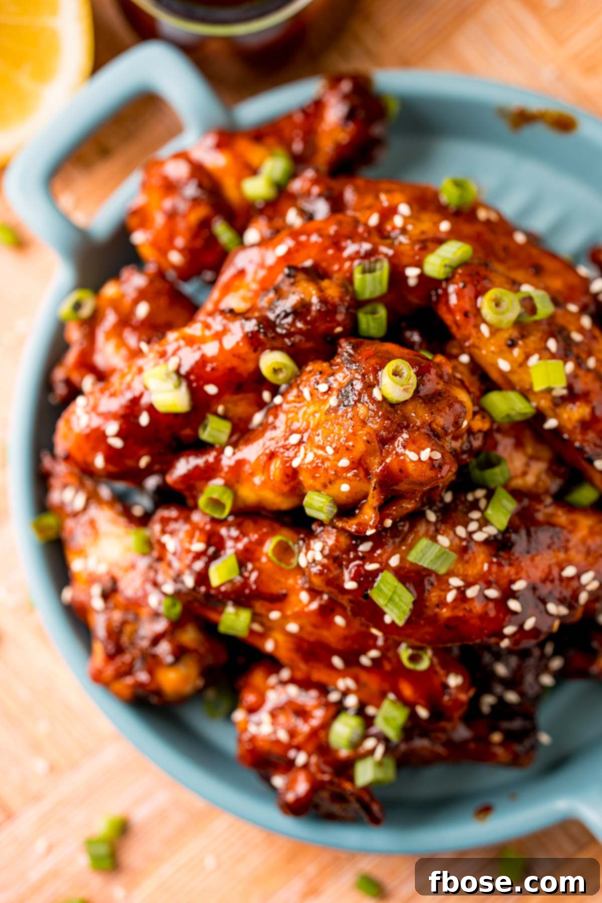 Sticky Korean BBQ Chicken Wings 3 Overhead photo of BBQ wings on a blue plate.