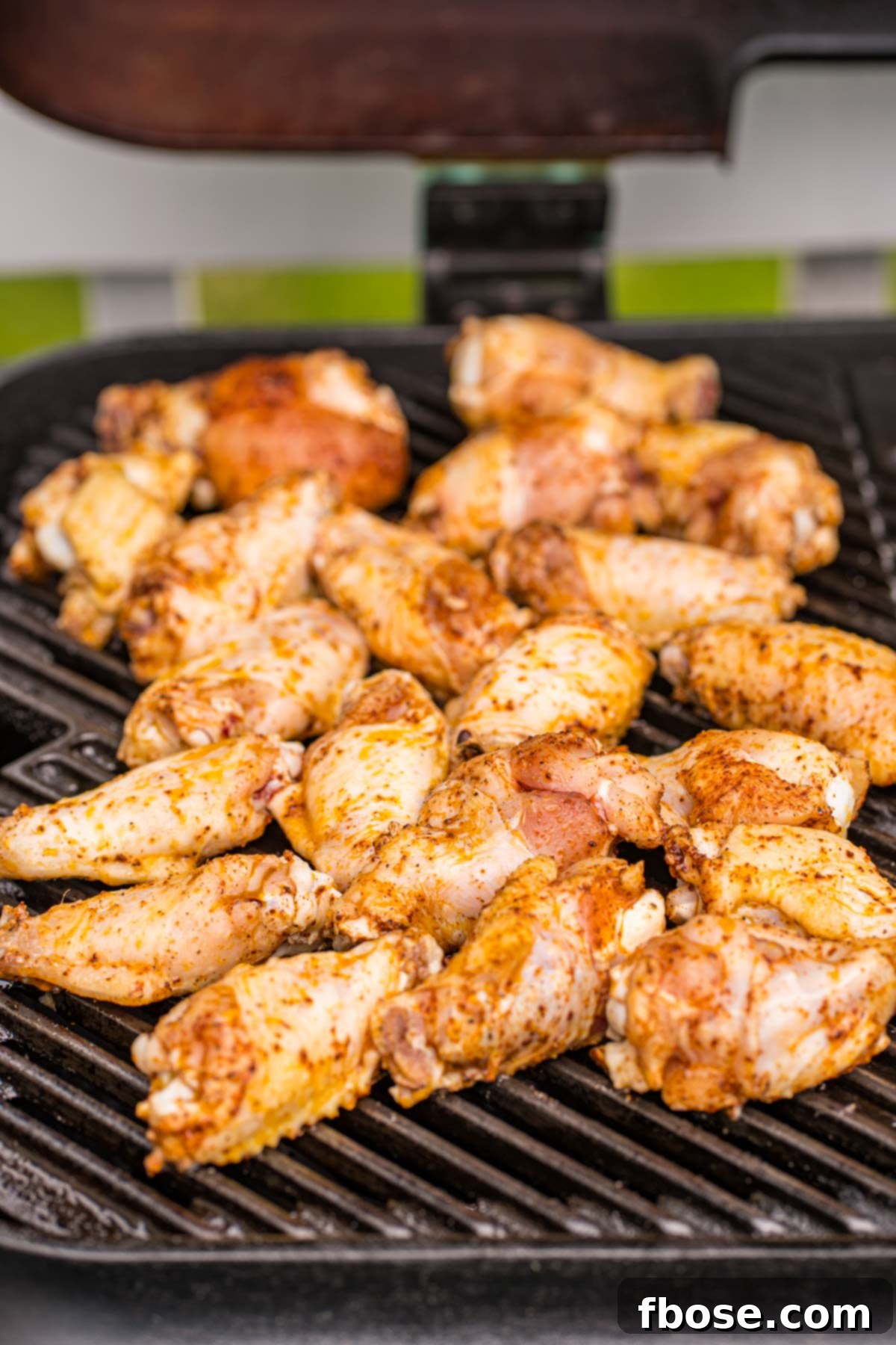 Sticky Korean BBQ Chicken Wings 5 Chicken wings being grilled on a grill.