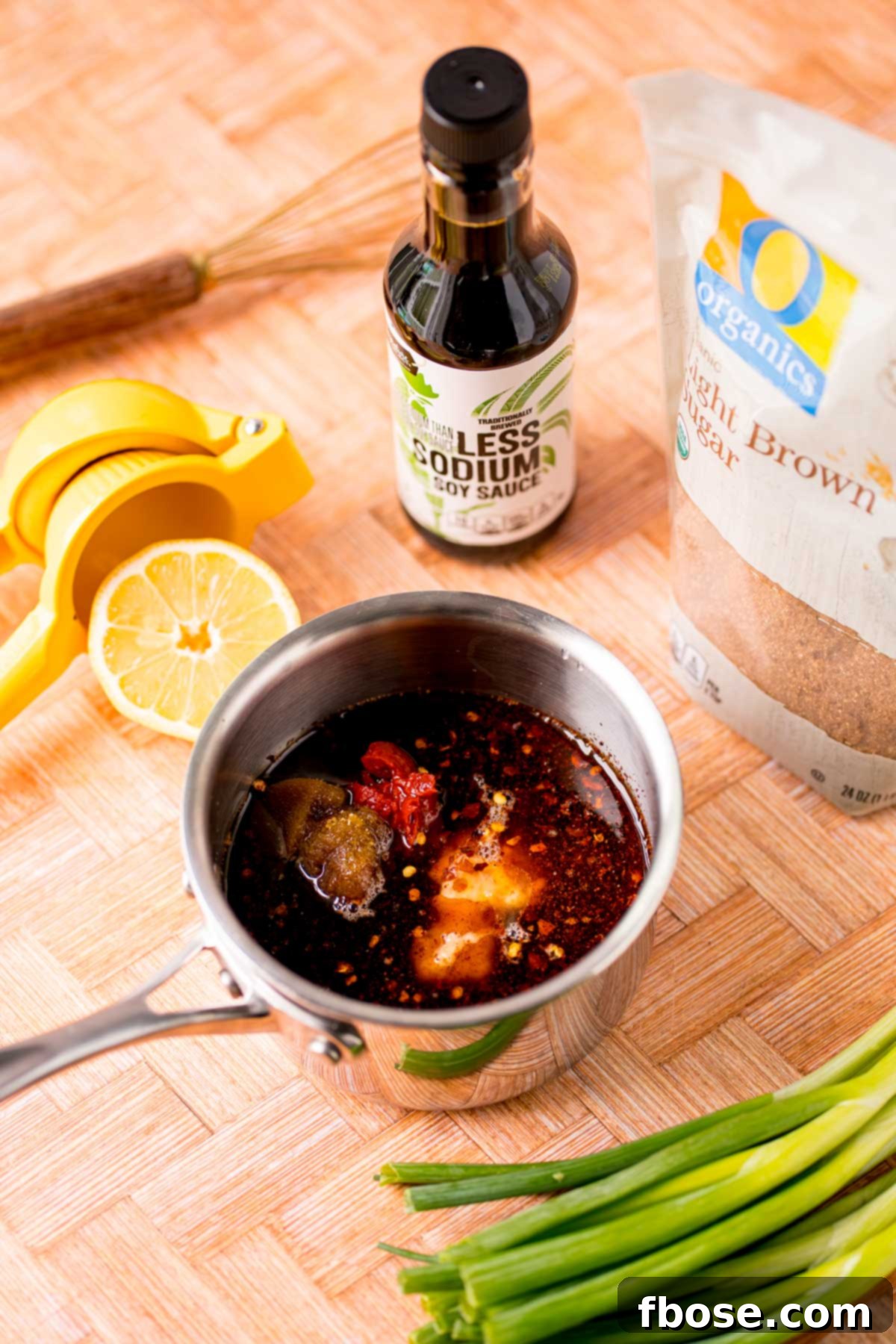 Sticky Korean BBQ Chicken Wings 6 Korean BBQ Sauce being made in a small stainless steel pot.