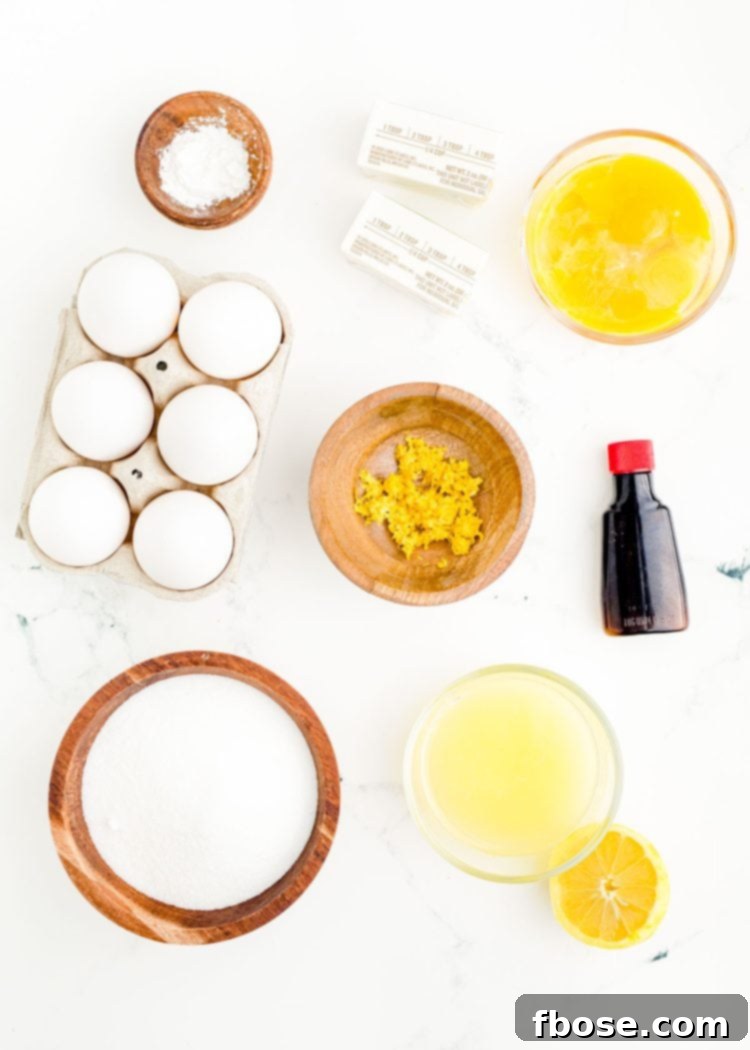Ingredients to make lemon curd prepared on a marble surface.