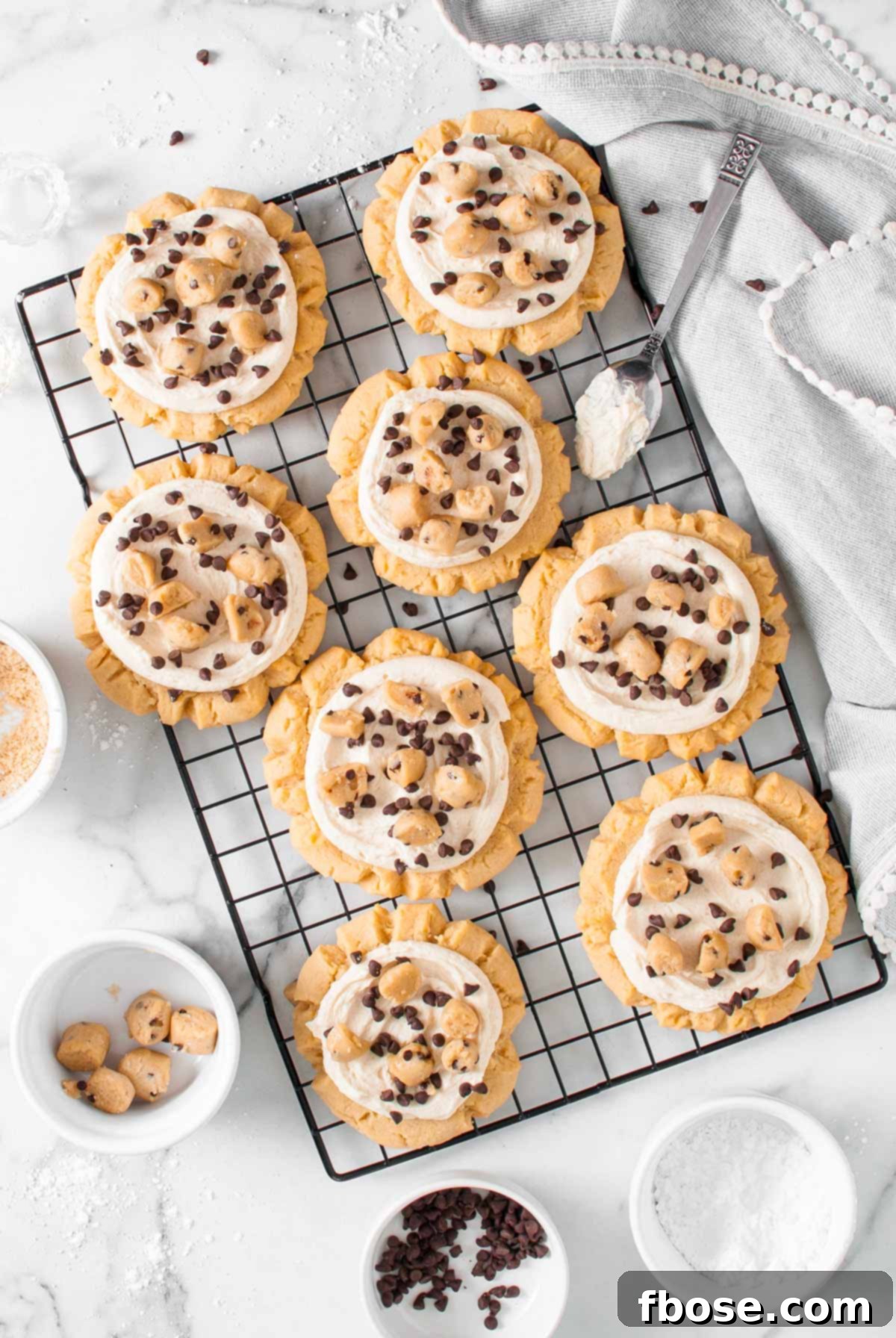 Overhead photo of crumble copycat cookie dough cookies on a wire rack.