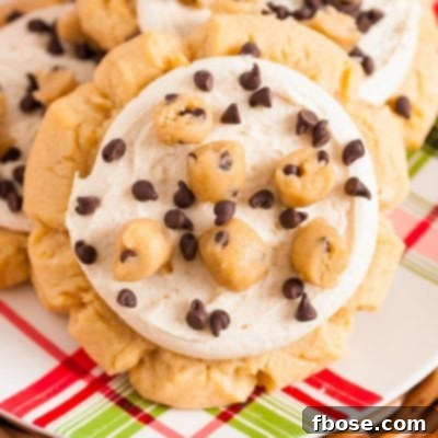 Close up of crumbl copycat cookie dough cookies on a red and green plaid plate.