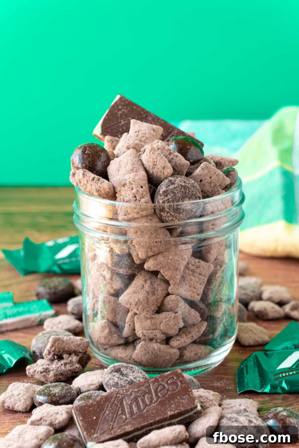 No-Bake Mint Chocolate Muddy Buddies 5 A jar filled with Andes mint muddy buddies.