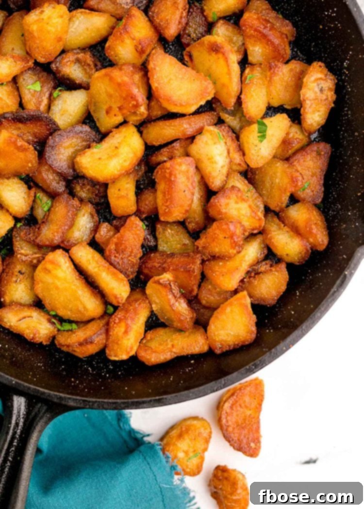 Duck fat potatoes in cast iron skillet.