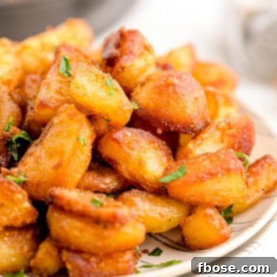 Crispy duck fat potatoes on a plate.