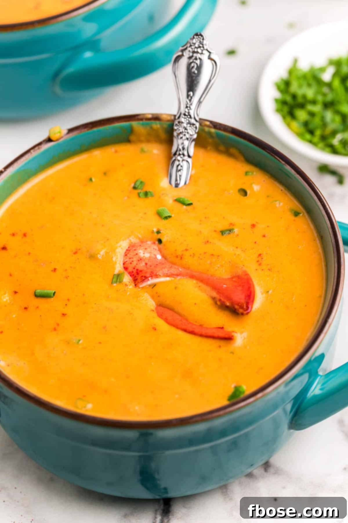 Ultimate Lobster Bisque From Scratch 3 Lobster bisque in a teal bowl.