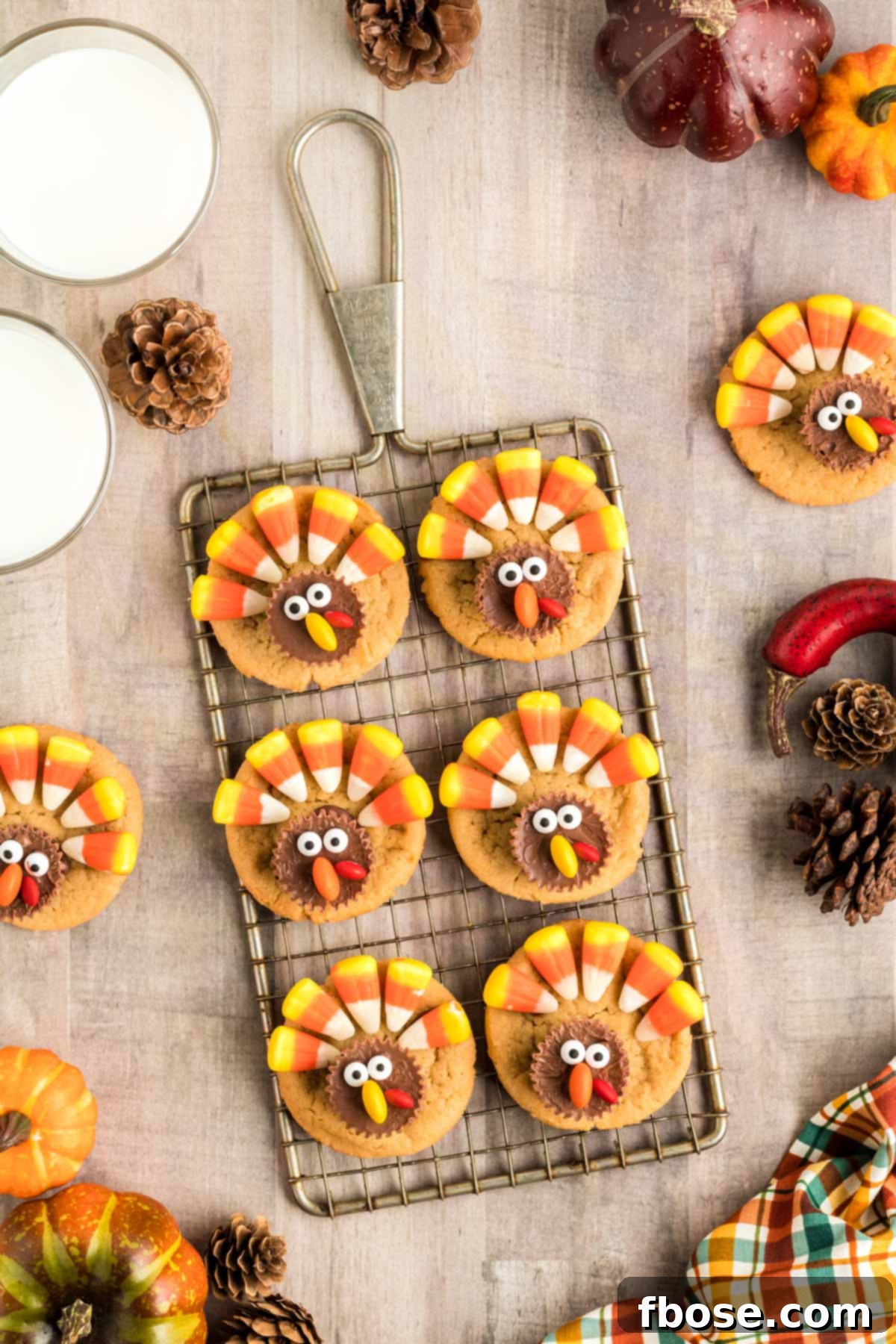 Overhead photo of turkey decorated cookies on a small wire rack.