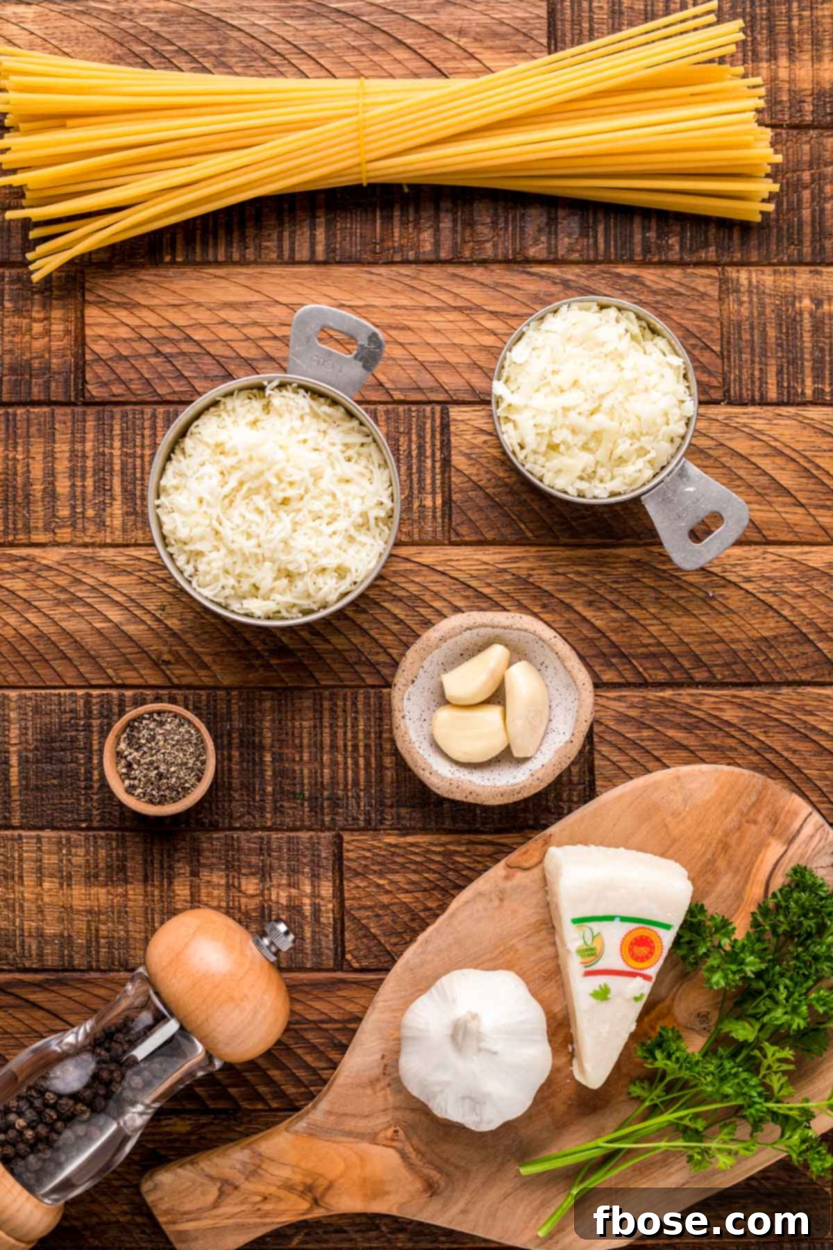 A close-up of bucatini cacio e pepe pasta, showcasing the creamy sauce and the thick, hollow noodles, ready to be served.