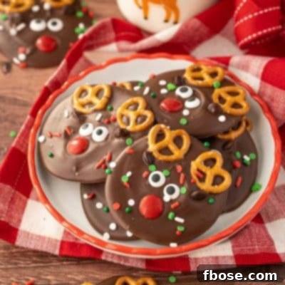 A small plate with Reindeer Christmas Bark on it with a bottle of milk in the background.