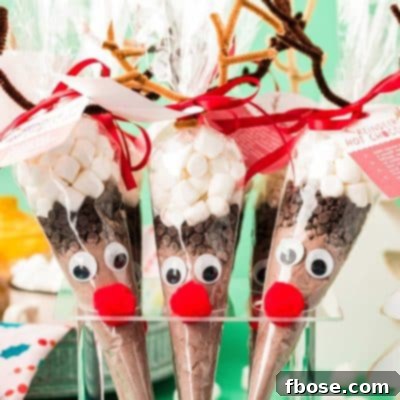 DIY Reindeer hot chocolate cones in an acrylic ice cream holder.
