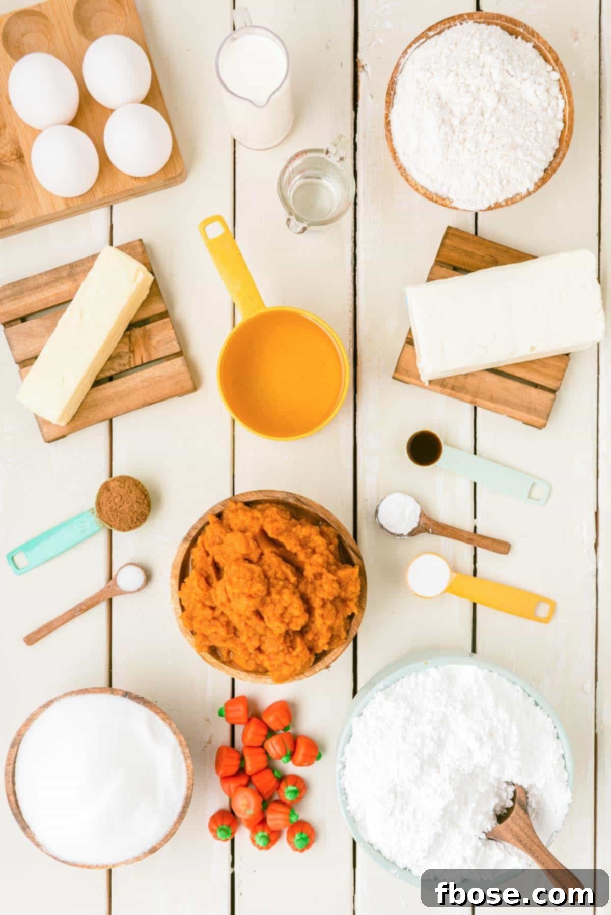 Effortless Autumn Pumpkin Bake 4 An overhead shot showcasing all the fresh ingredients meticulously laid out on a table, ready to be transformed into a delicious pumpkin cake.