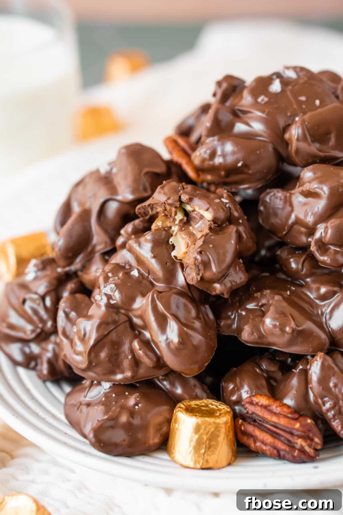 Turtle crockpot candies on a white plate.