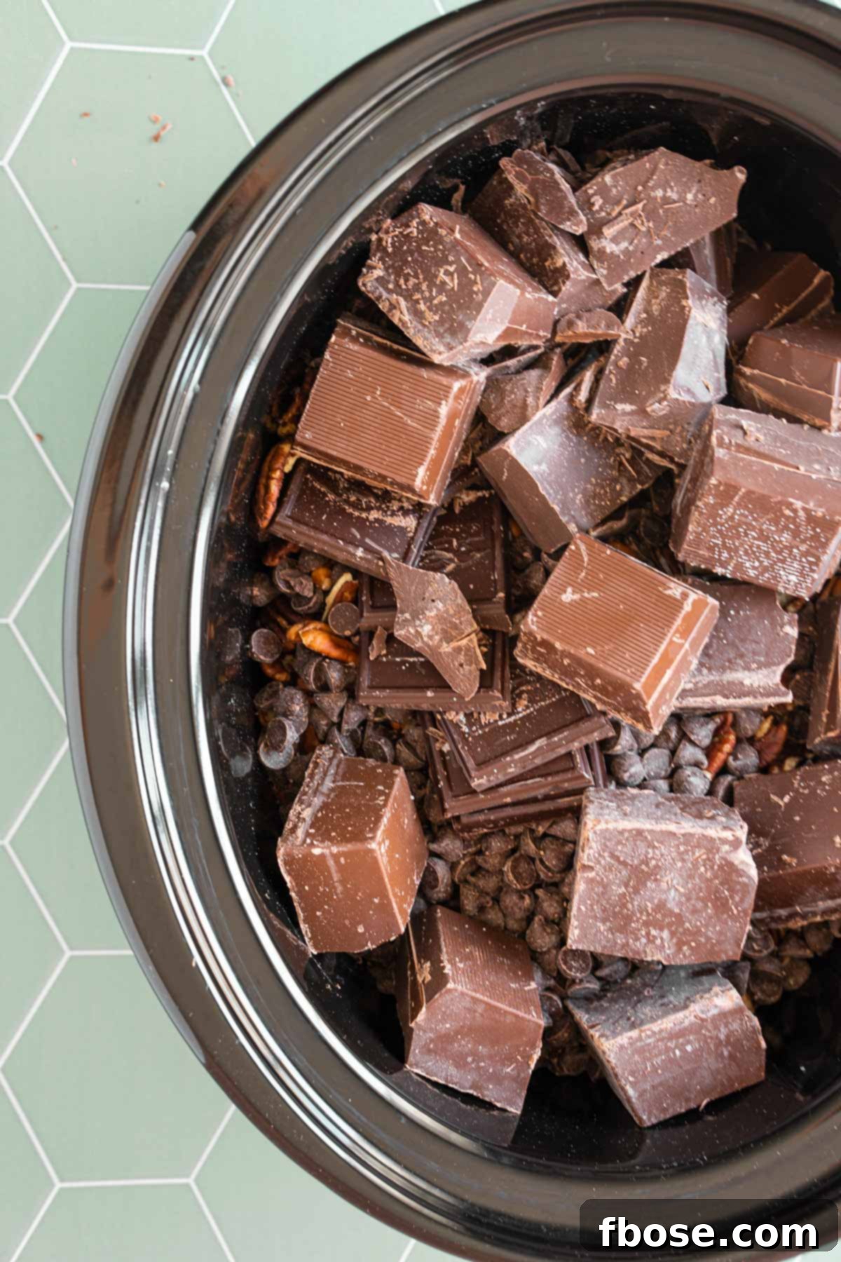 Turtle candies being made in the crockpot.