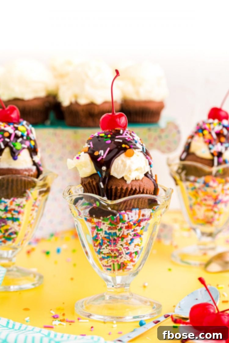Straight on photo of brownie cupcakes in sundae dishes on a yellow surface.
