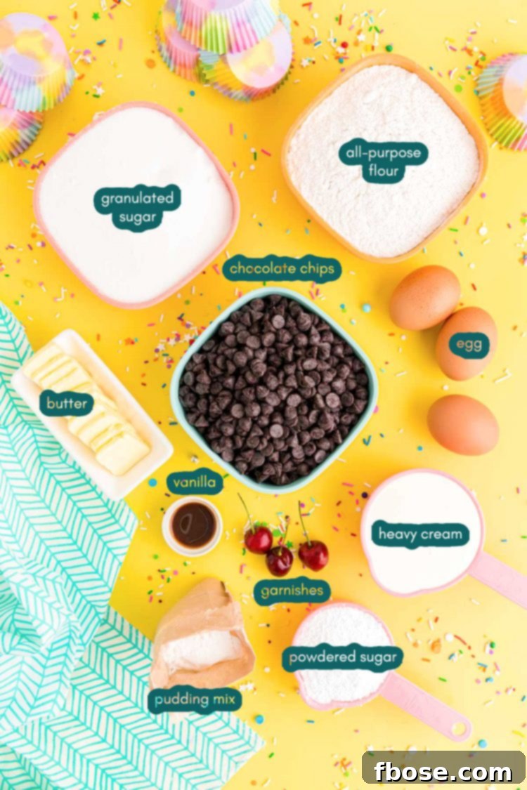overhead photo of ingredients to make brownie cupcakes on a yellow surface with a teal napkin and rainbow sprinkles scattered around.