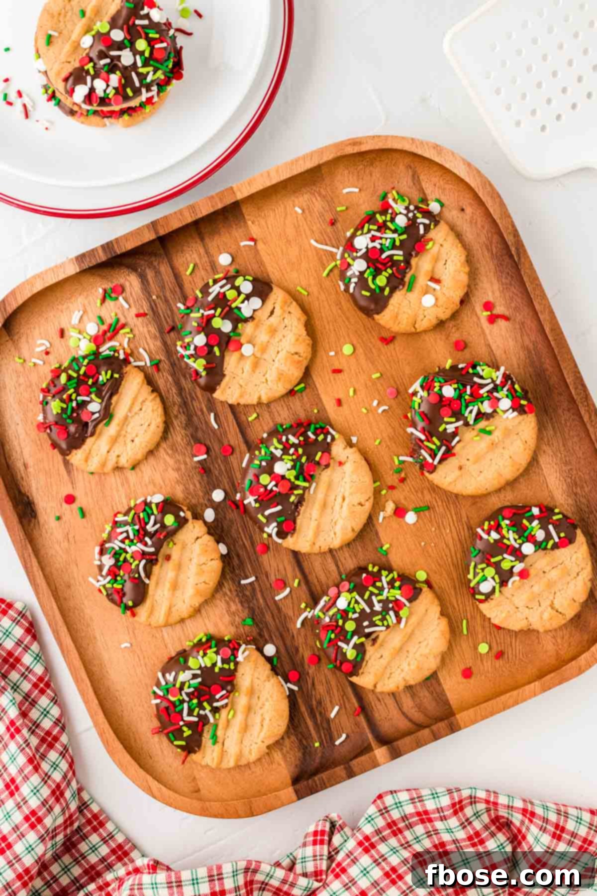 Peanut butter Christmas cookies on a wooden board.