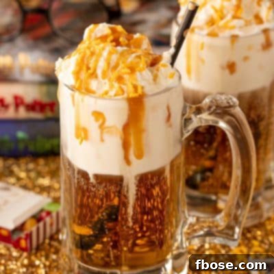 Close up of a beer mug filled with butterbeer dirty soda.