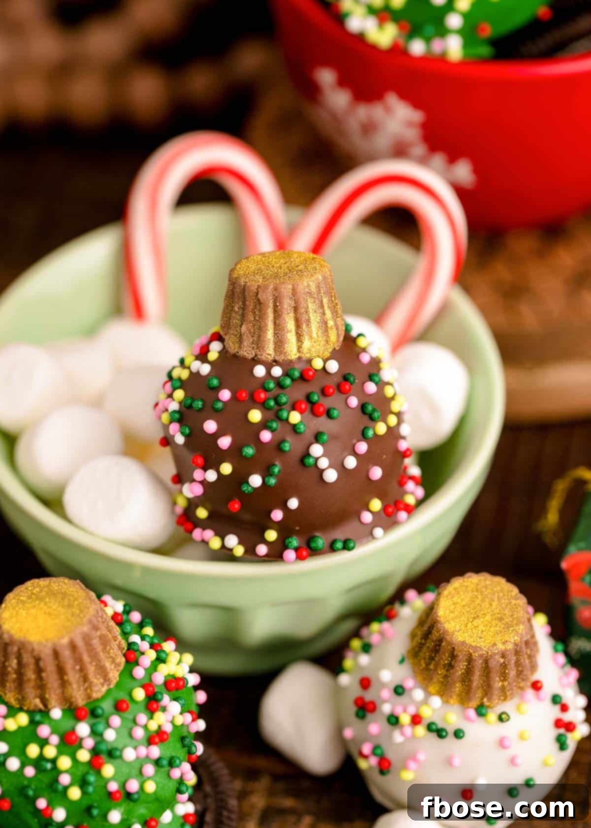 Christmas Ornament Oreo Balls on a wooden table.