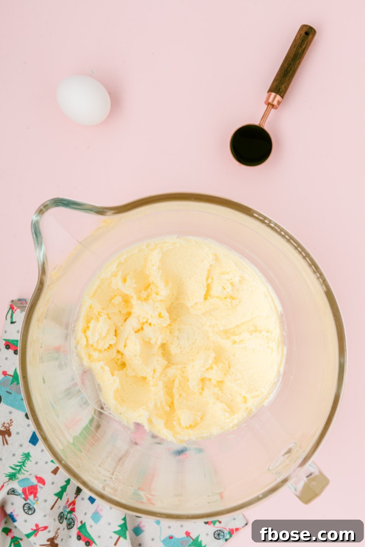 Butter and sugar creamed in a mixing bowl.