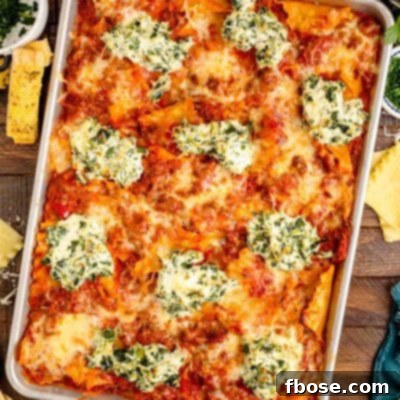 Overhead photo of sheet pan lasagna on a wooden table.