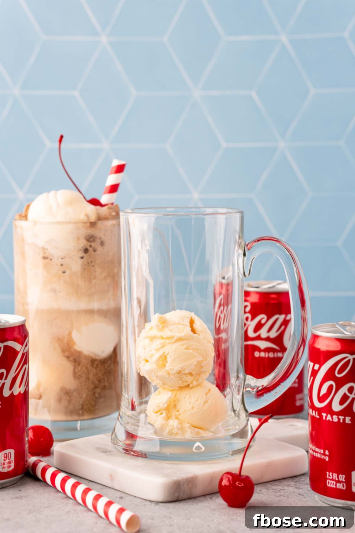 Two scoops of vanilla ice cream in a tall glass beer stein.