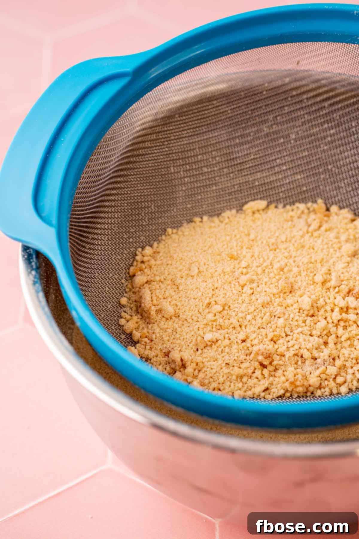 The Secret to Toasted Sugar 6 Beautifully toasted sugar being sifted into a bowl, ensuring a fine, consistent texture for baking.