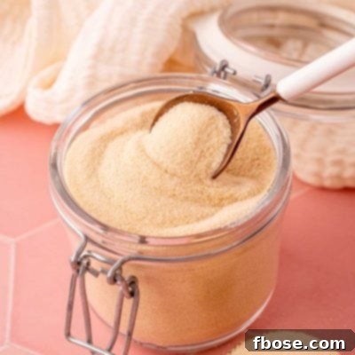The Secret to Toasted Sugar 9 A spoon scooping toasted sugar out of a glass canister.