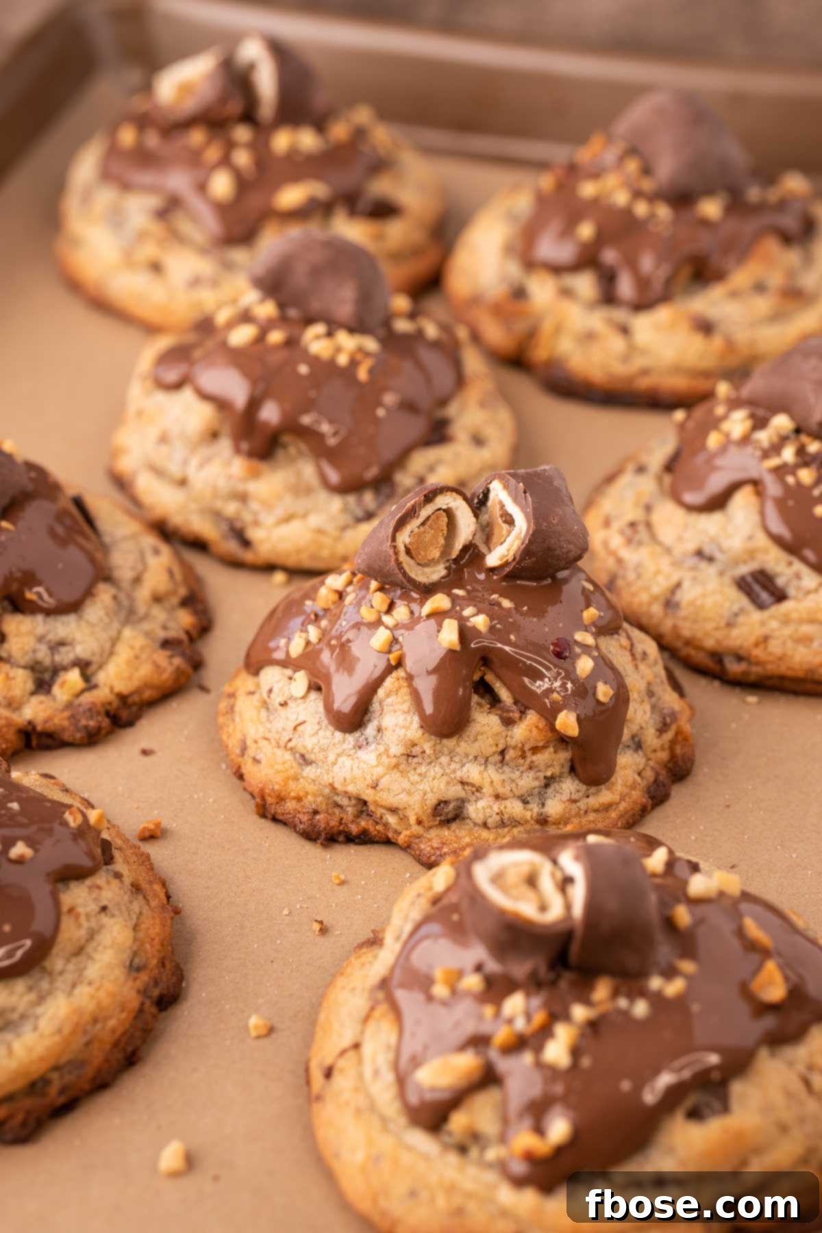 Ultimate Comfort Cookies 7 Freshly portioned gourmet Chubby Hubby Cookies arranged on a parchment-lined baking sheet, ready for chilling and baking.
