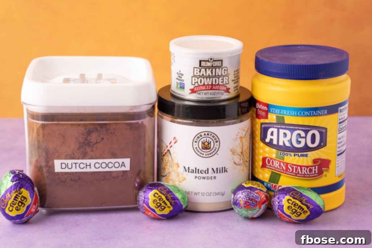 Ultimate Cadbury Creme Egg Cookies 4 A few ingredients for baking cadbury egg cookies on a purple surface.