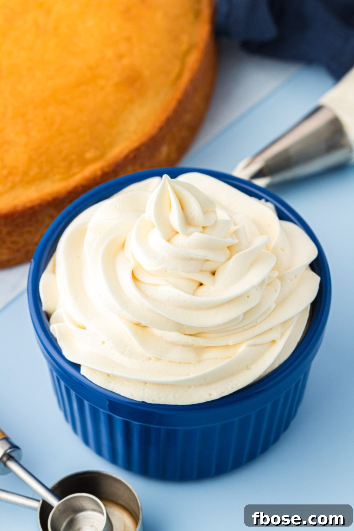 Vanilla Frosting piped into a blue bowl.