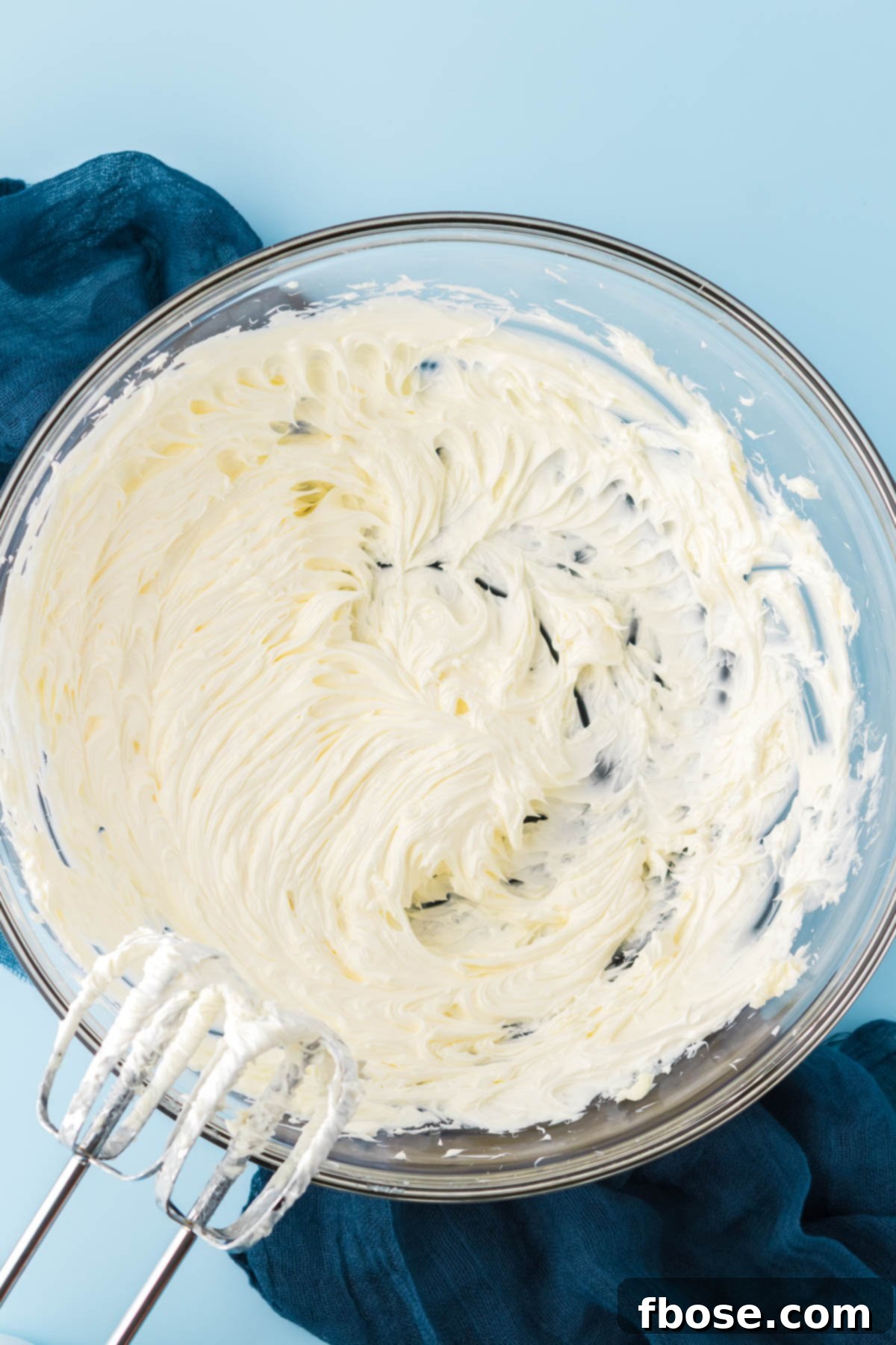 Creamed butter in a large glass bowl.