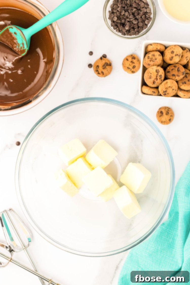 Butter cut up in a mixing bowl.