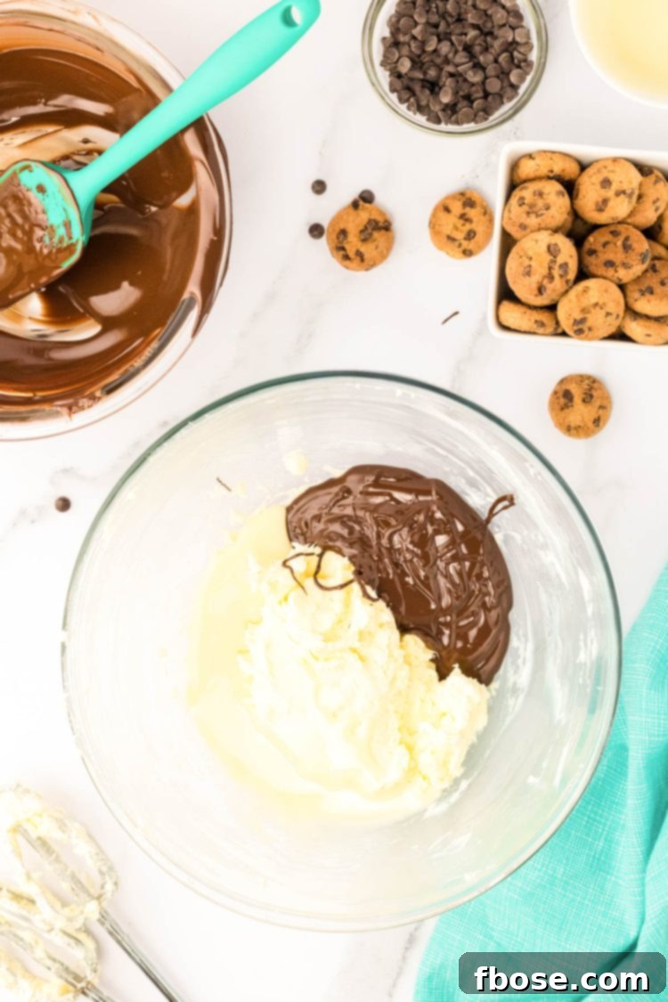 Melted chocolate and creamed butter in a mixing bowl.