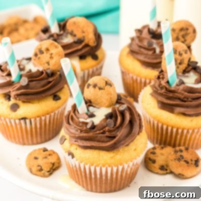 Milk and Cookies cupcakes on a white cake stand.