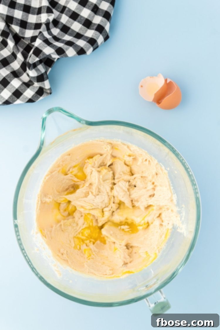 Butter and sugar creaming in a stand mixer.